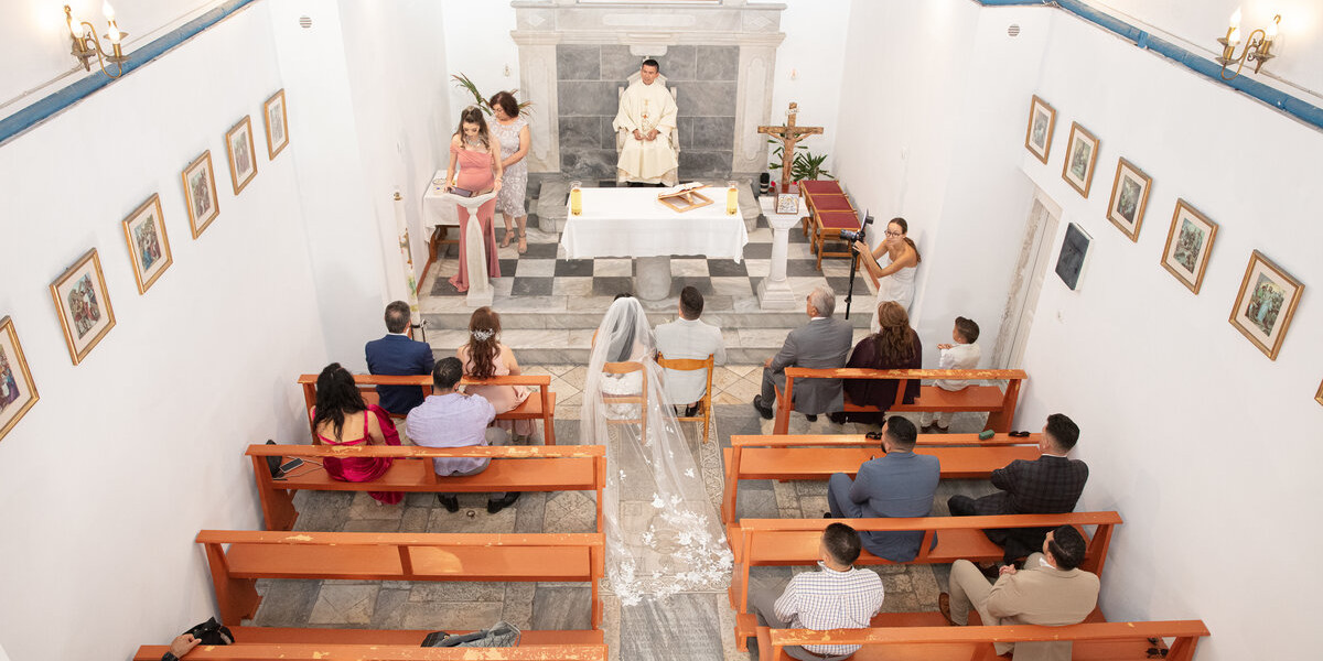 A serene church setting for a wedding ceremony, highlighting the charm of a Mykonos Catholic wedding package.