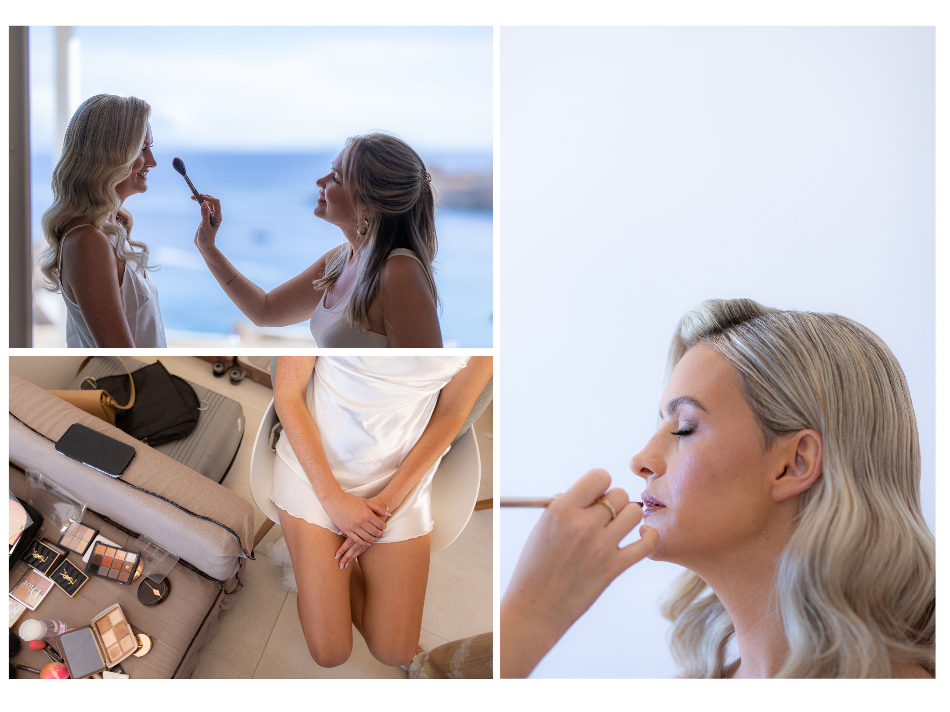 A woman in a white dress sits in a bright room, surrounded by makeup products, while another woman applies makeup to her face. Mykonos wedding beauty services.