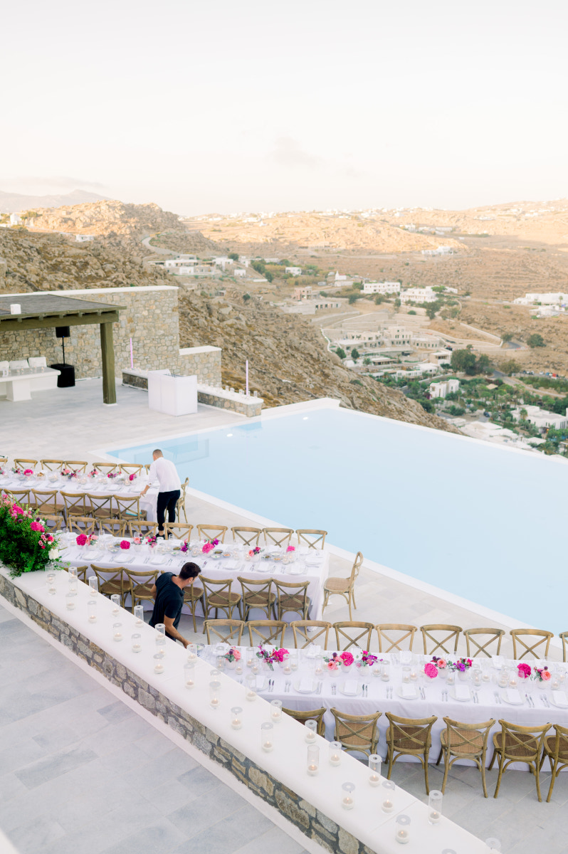 A luxurious wedding reception at a Mykonos villa, featuring stunning sea views and elegant decor.